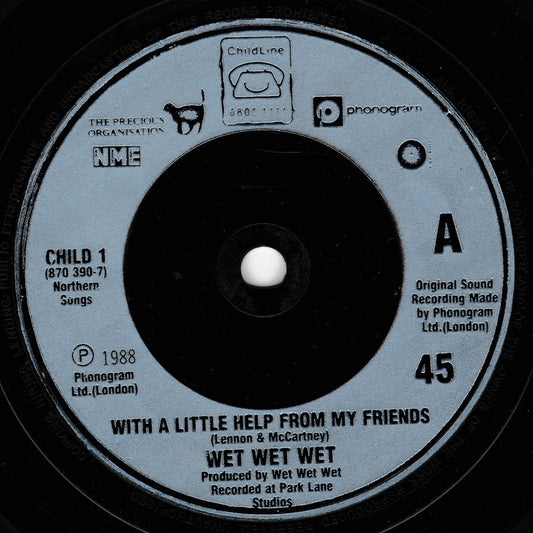 A close-up of a vinyl record label for Wet Wet Wet's 'With A Little Help From My Friends', showing the A-side track with Child Line and Phonogram branding.