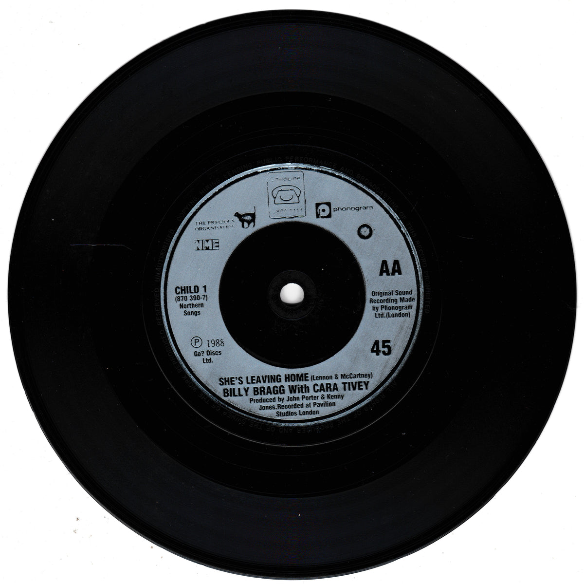 A black vinyl record with a silver centre label, featuring the song 'She's Leaving Home' by Billy Bragg with Cara Tivey. The record is photographed from directly above against a plain white background.