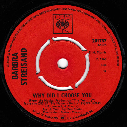 A close-up of a red vinyl record label for CBS Records, featuring the artist names Barbra Streisand and the song title 'Why Did I Choose You'.