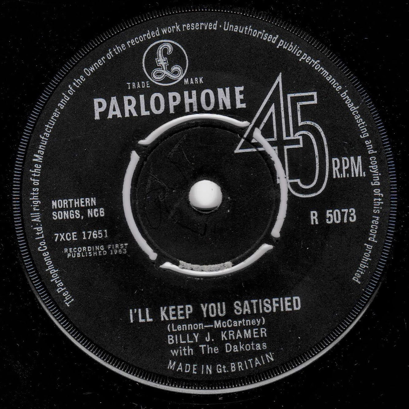 A black vinyl record label for Parlophone, featuring white printed text and graphics. The label reads 'Parlophone', '45 RPM', and 'I'll Keep You Satisfied' by Billy J. Kramer.