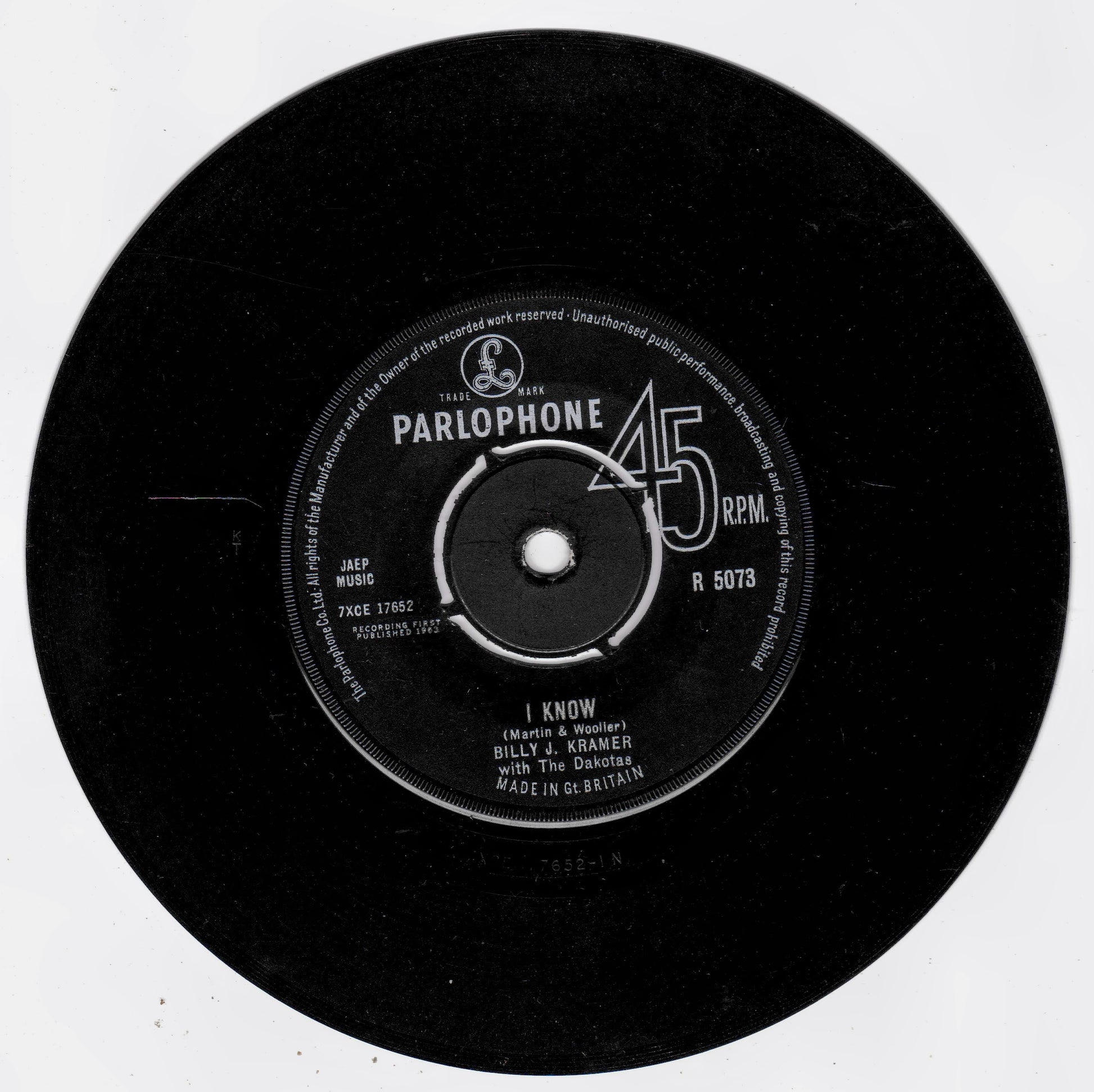 A vintage black 45 RPM vinyl record with a white Parlophone label, featuring the song 'I Know' by Billy J. Kramer and The Dakotas.
