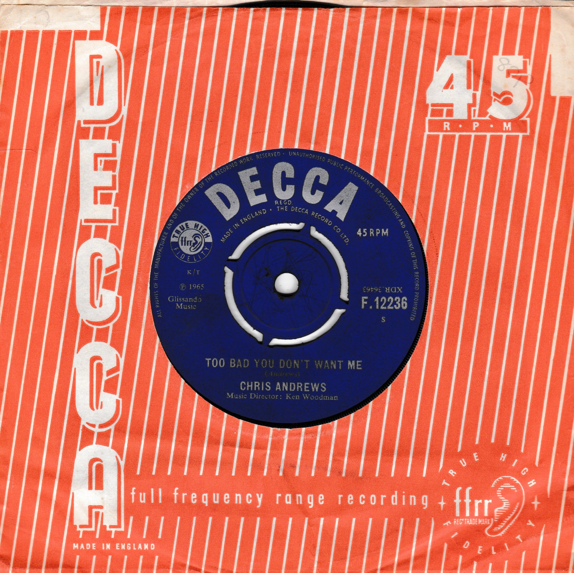 A vintage 45 RPM Decca record sleeve for Chris Andrews' song 'Too Bad You Don't Want Me', featuring a blue record label centred on an orange and white striped background with white text and graphics.