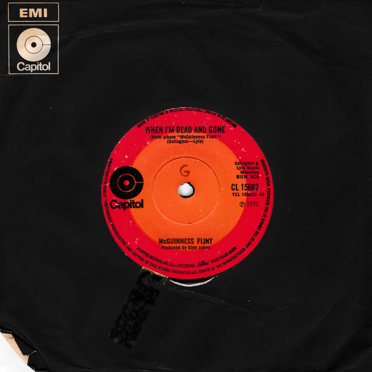 A vintage black vinyl record featuring a bright red and orange centre label for McGuinness Faint's song 'When I'm Dead and Gone' on Capitol Records. The EMI Capitol logo is visible in the top-left corner.