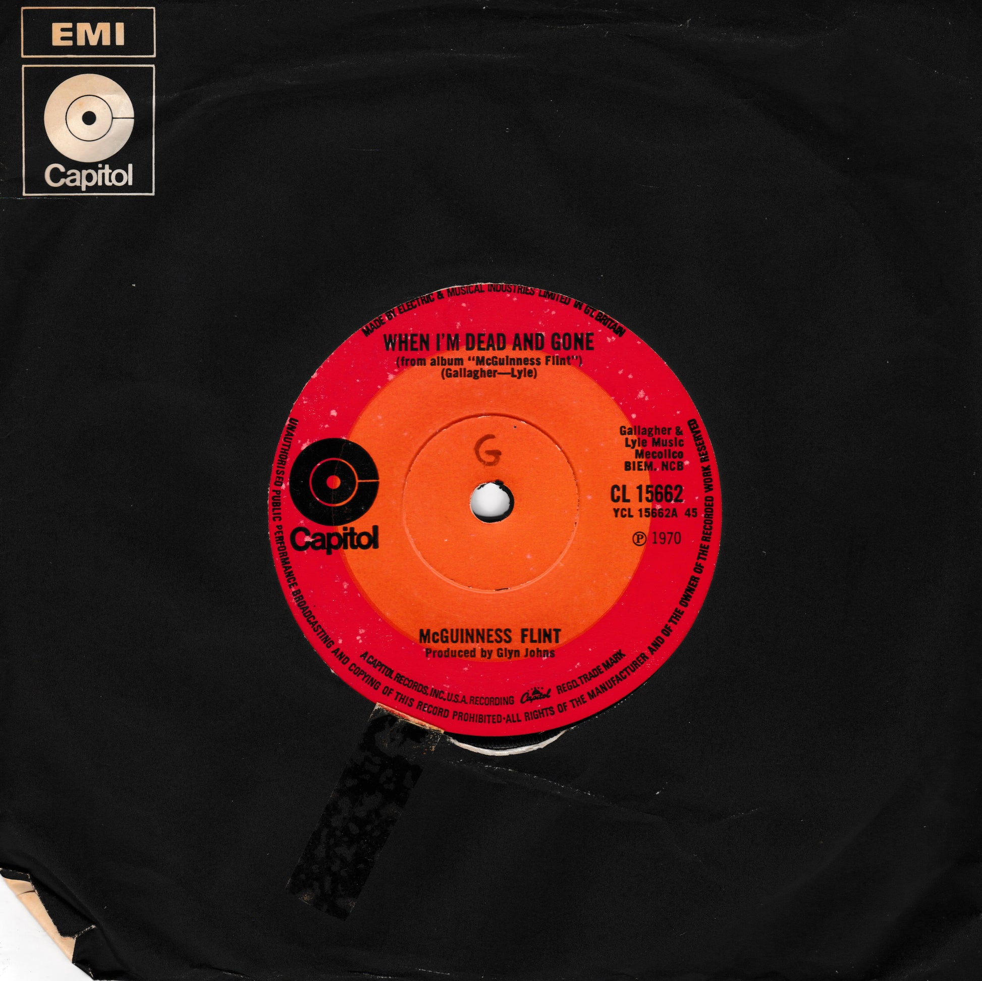 A vintage black vinyl record featuring a bright red and orange centre label for McGuinness Faint's song 'When I'm Dead and Gone' on Capitol Records. The EMI Capitol logo is visible in the top-left corner.