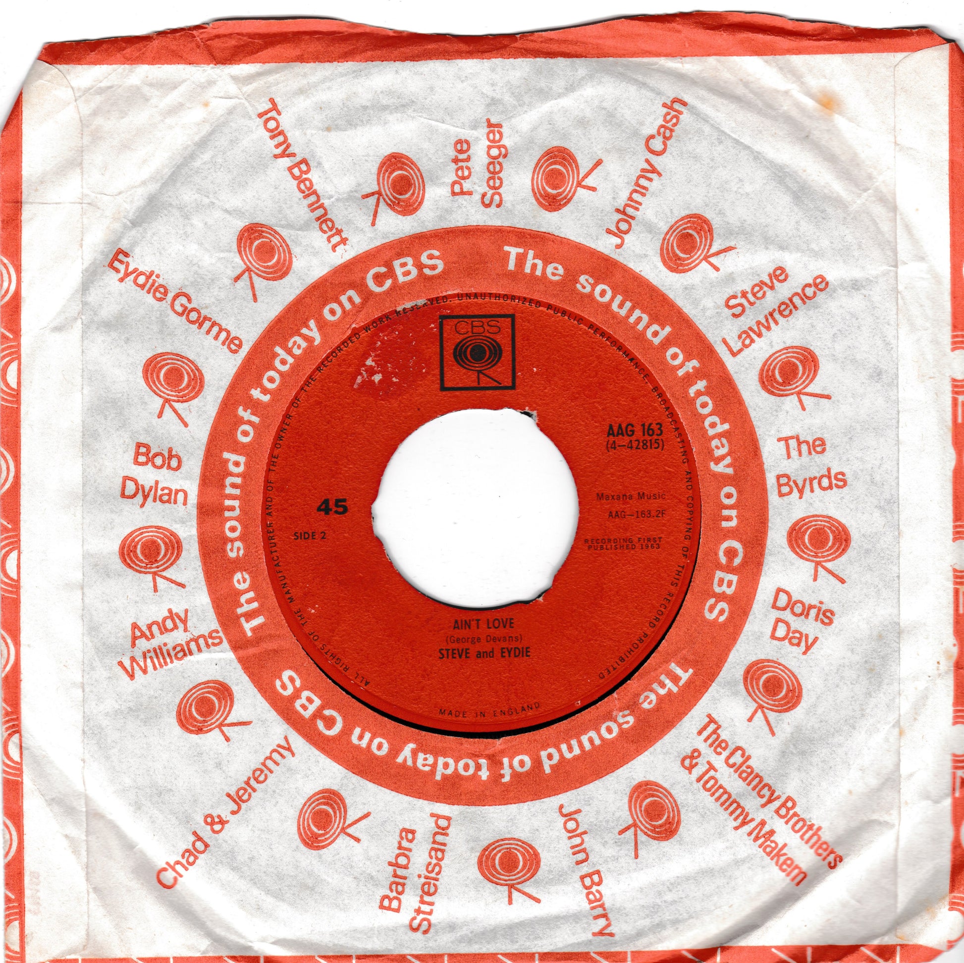 A vintage CBS single sleeve for Steve and Eydie's 45 rpm record 'All Love', featuring a red centre label and orange printed text and lollipop graphics on a white paper sleeve.