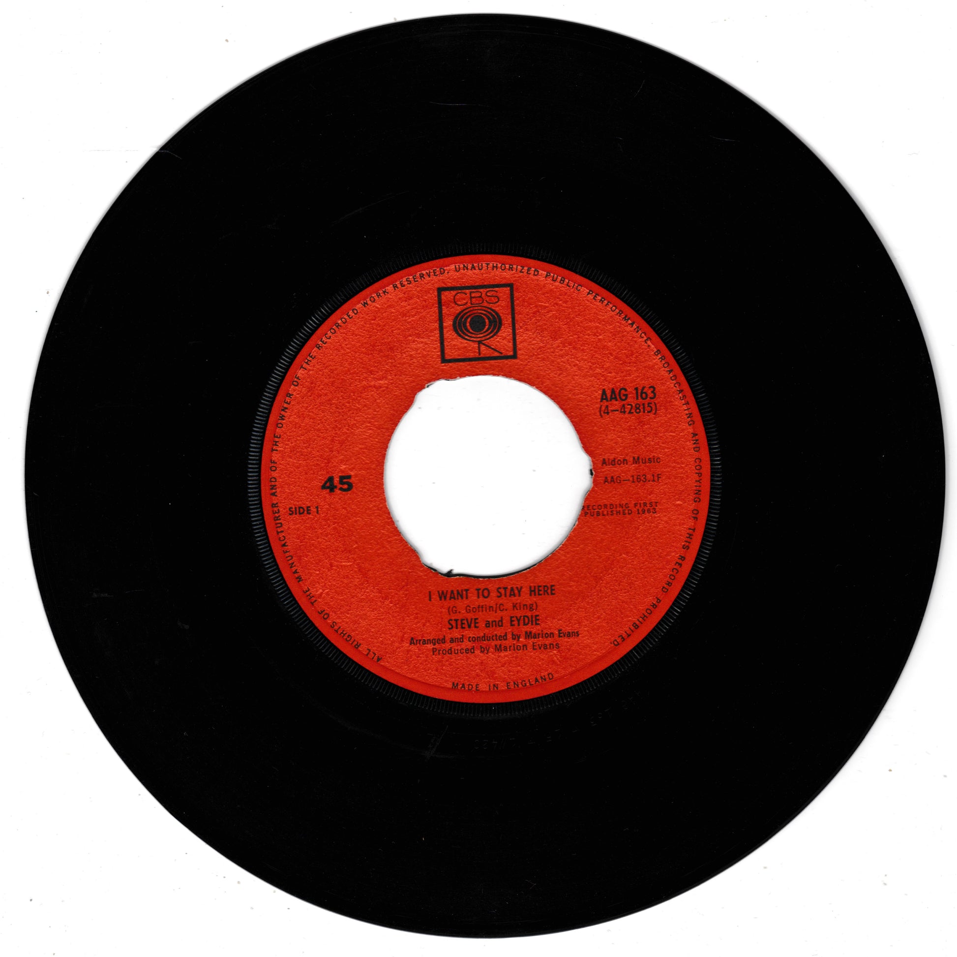 A vintage 45 RPM vinyl record featuring the red centre label of Steve and Eydie, with the song 'I Want to Stay Here'. The black vinyl disc is shown against a plain white background.