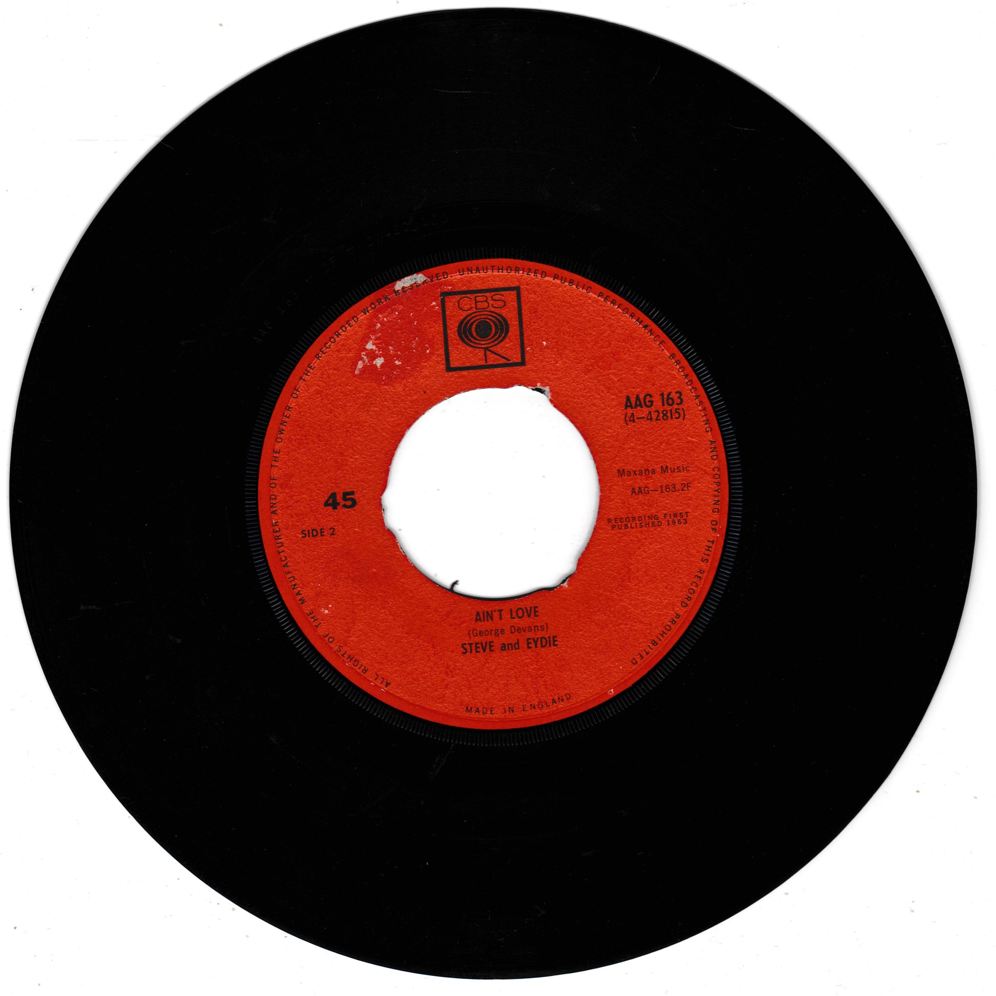 A vintage 45 RPM vinyl record with a black outer disc and a bright red-orange centre label. The label features black printed text including the song title 'Don't Care' and artist 'Steve and Eydie', along with a small square logo near the top.