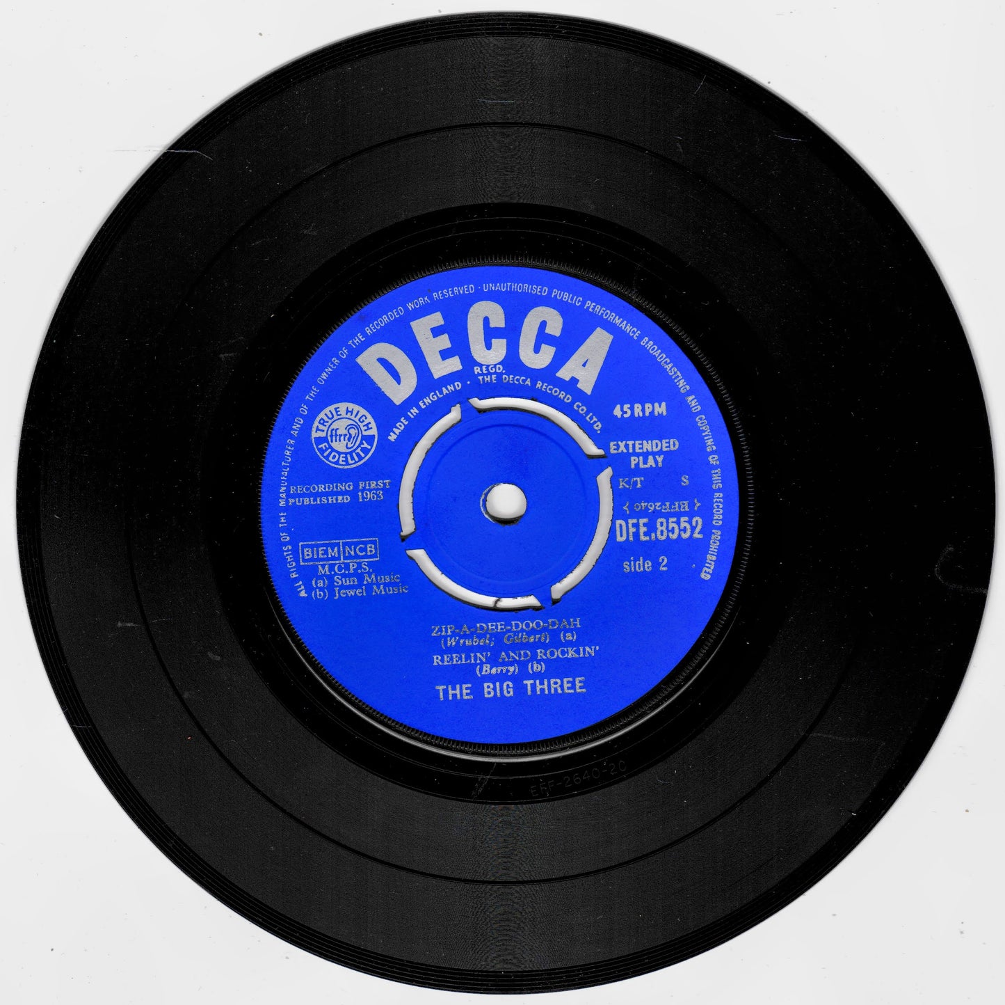 A black 7-inch vinyl record with a bright blue centre label reading 'DECCA' and 'The Big Three', photographed on a plain light background.