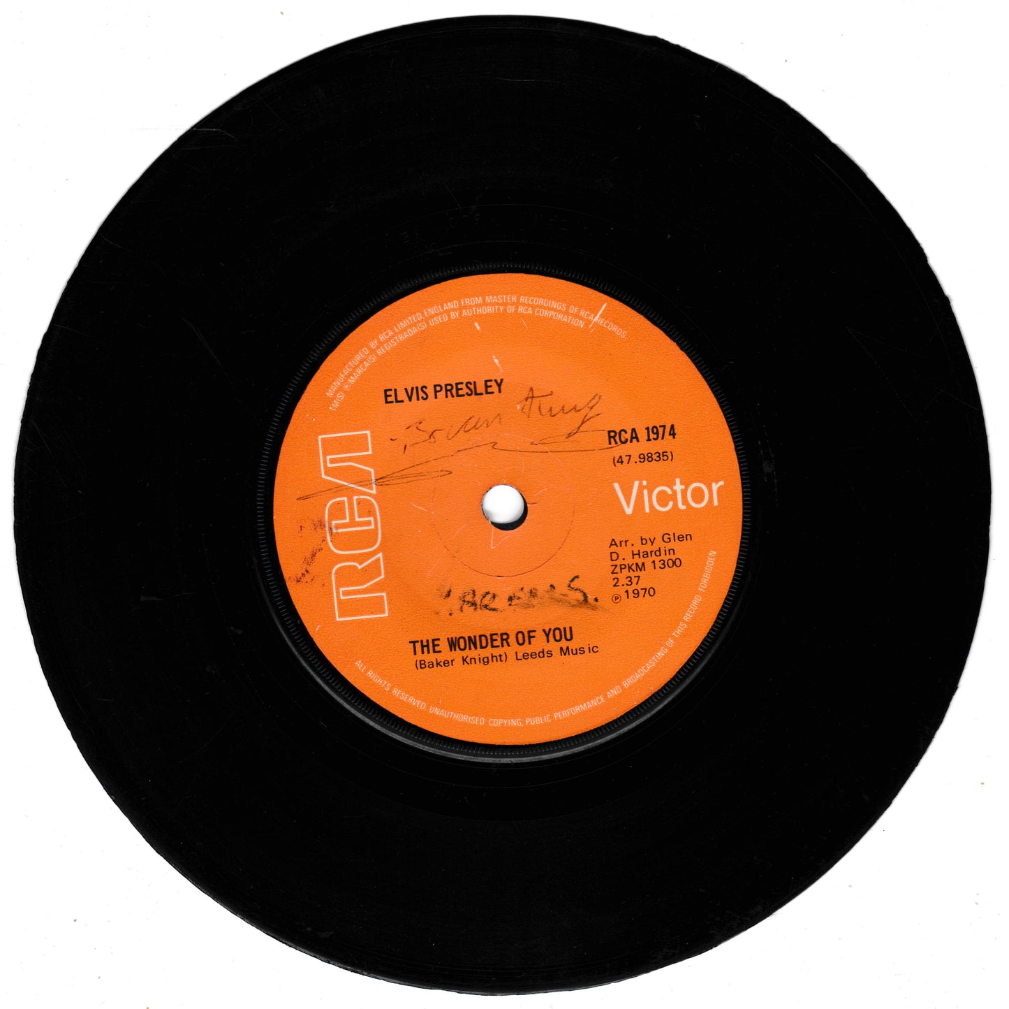 A black vinyl record with an orange RCA Victor label, featuring Elvis Presley's 'The Wonder of You'.