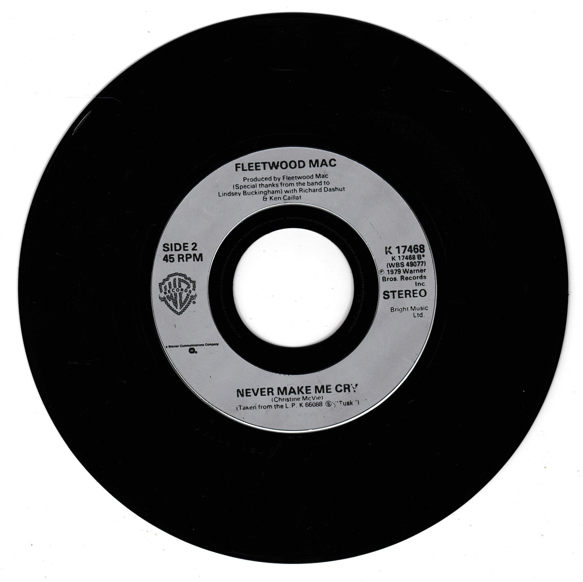 A Fleetwood Mac 'Never Make Me Cry' 45 RPM vinyl record, Side 2, showing the black vinyl disc and its silver centre label against a white background.