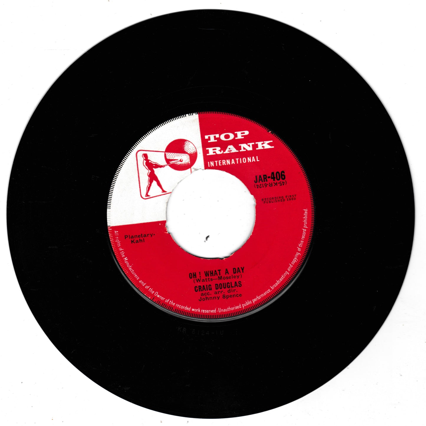 A black vinyl record with a red and white centre label reading TOP RANK INTERNATIONAL, featuring the song 'What a Day' by Craig Douglas.