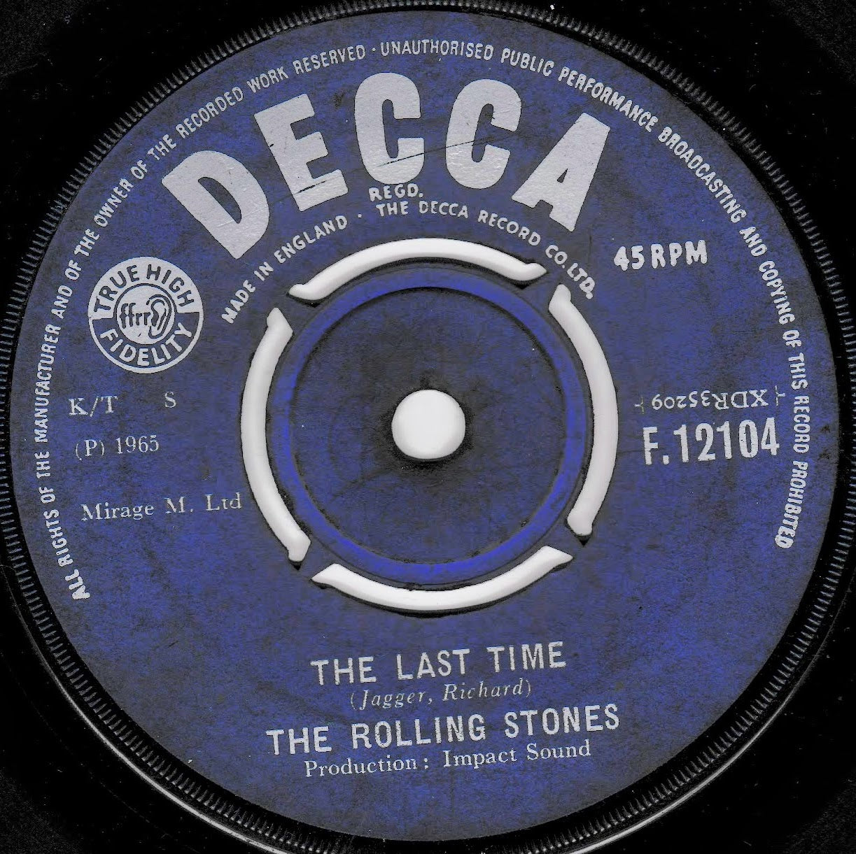 A close-up of a vintage Decca 7-inch record label for The Rolling Stones' 'The Last Time', featuring a blue and purple design with white text and a central spindle hole.