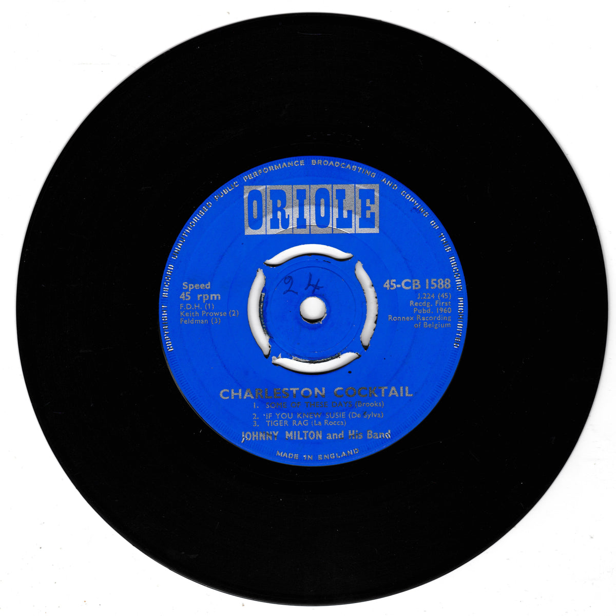 A black vinyl record with a bright blue centre label reading Oriole, featuring the song 'Charleston Cocktail' by Johnny Milton.