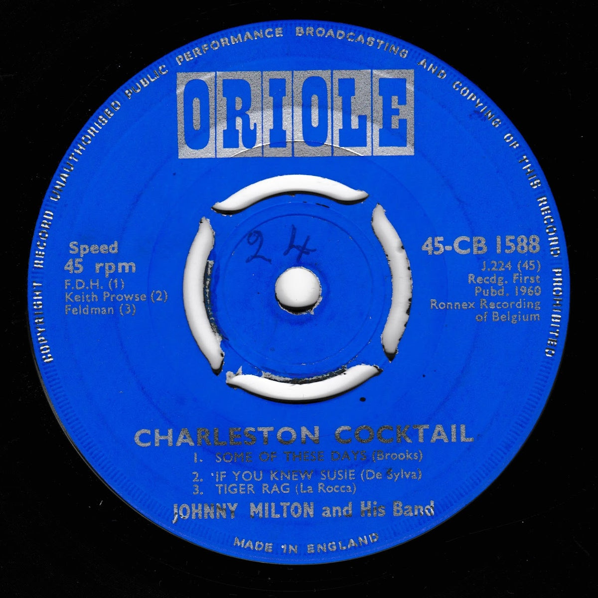 A blue Oriole 45 rpm vinyl record label for 'Charleston Cocktail' by Johnny Milton and His Band, photographed against a black background.