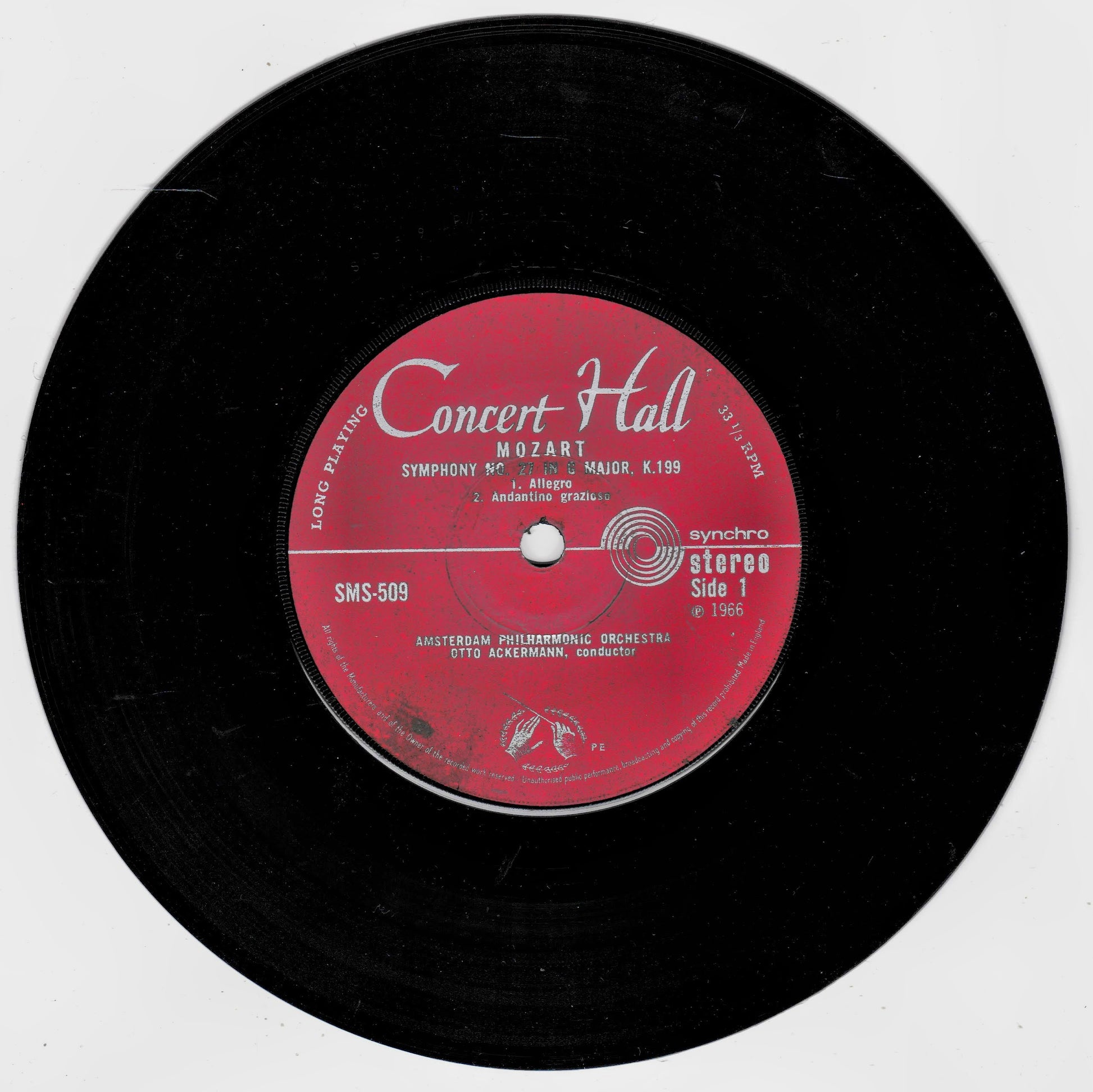 A black vinyl record with a red centre label reading 'Concert Hall' and 'Mozart Symphony No. 9 in D minor K.