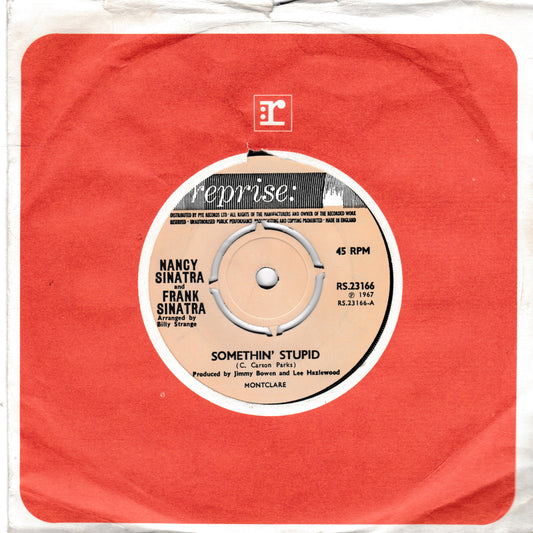 A vintage 45 single record sleeve for Nancy Sinatra and Frank Sinatra's 'Somethin' Stupid' on the Reprise label, featuring a textured red paper background and a beige centre label.