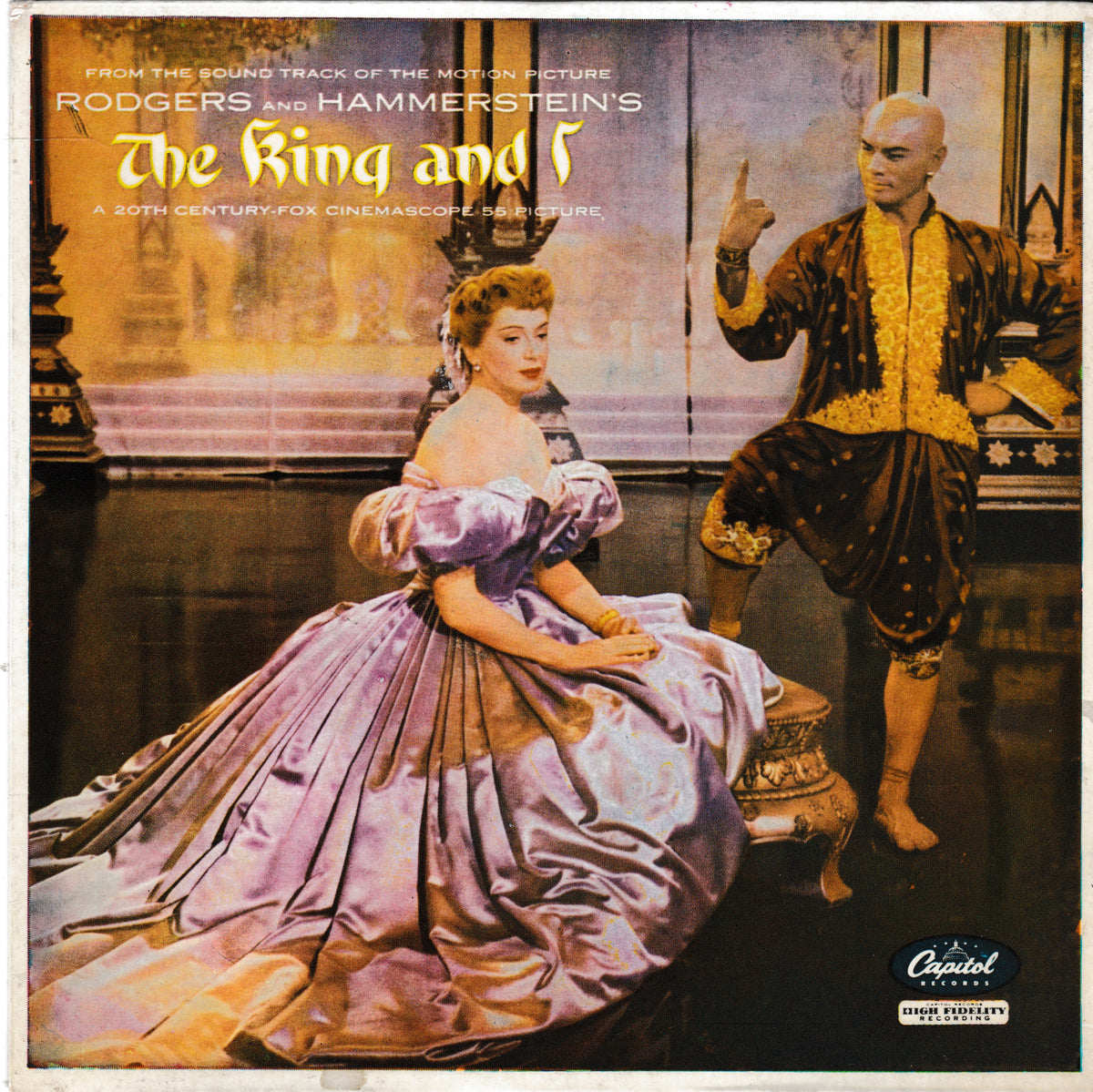 The King and I soundtrack EP cover, featuring a seated woman in a lavender gown and a standing man in a dark ornate costume on a stage-like background. Text at the top reads 'From the sound track of the motion picture Rodgers and Hammerstein's The King and I' with a Capitol Records logo at the bottom right.