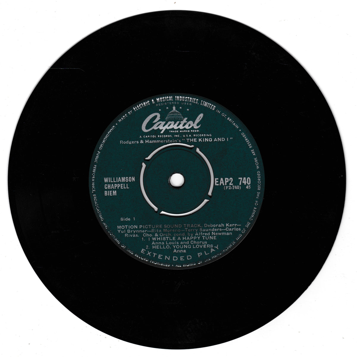 A vintage 7-inch vinyl record label from Capitol Records, featuring the 'The King and I'. The black record is shown against a plain white background, highlighting the dark green and white centre label with white text.