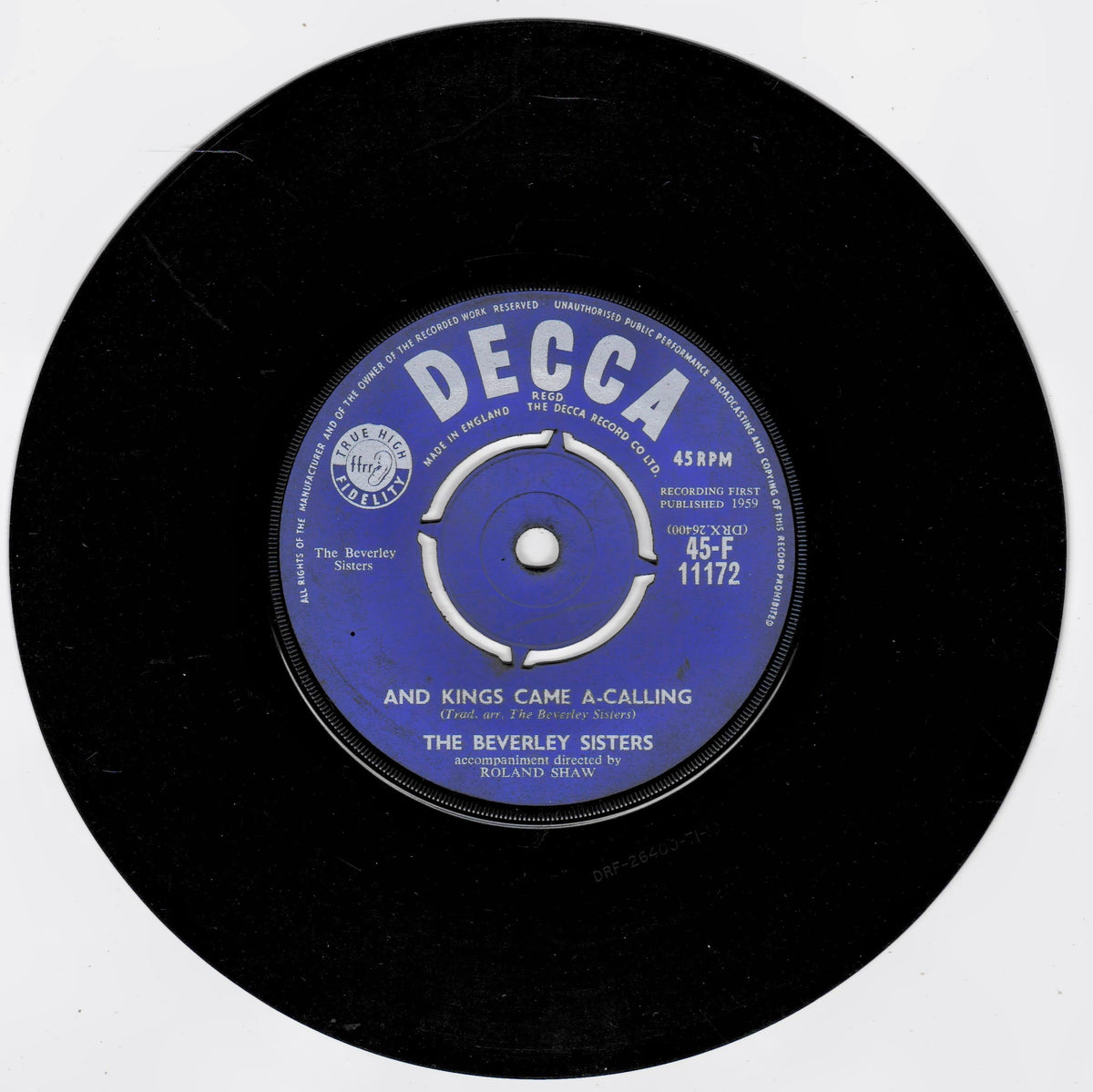 A black vinyl record with a blue and white centre label reading 'DECCA' and 'The Beverley Sisters' and 'And Kings Came A-Calling', photographed on a plain white background.