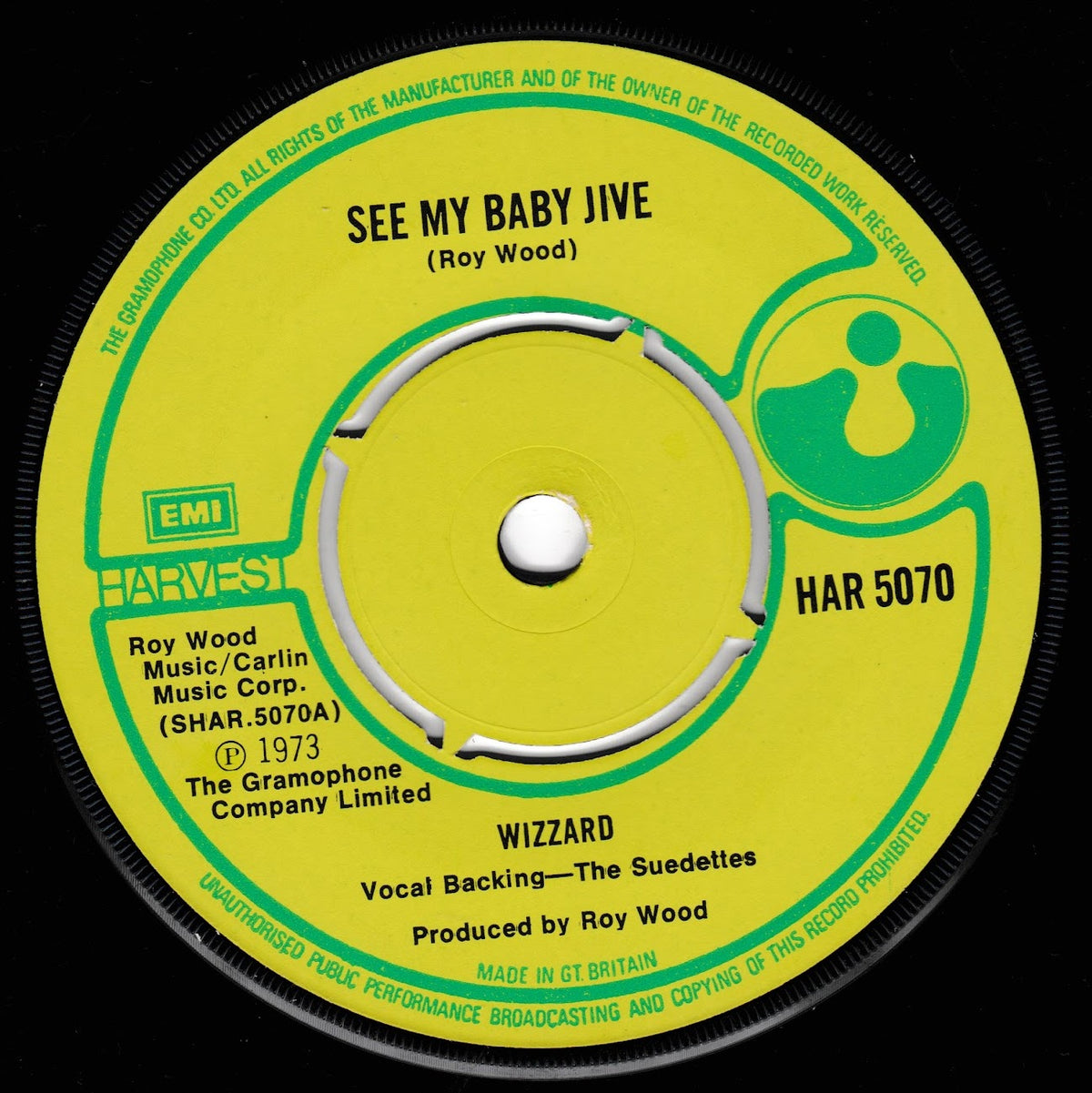 A vintage 1973 45 single record label for Roy Wood's 'See My Baby Jive' and 'Wizzard', featuring a bright yellow-green centre label with green and black text on a black vinyl background.