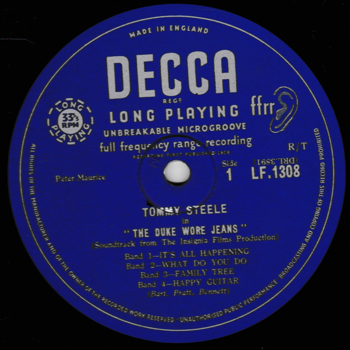 A blue and black DECCA vinyl record label for Tommy Steele's 'The Duke Wore Jeans', featuring white and yellow text on a black background.