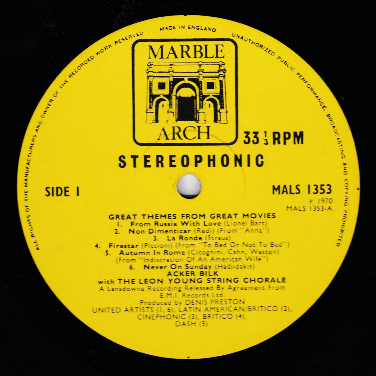 A yellow vinyl record label for Marble Arch Arch Stereophonics, featuring the album 'Great Themes From Great Movies' with black text and a central logo on a black background.