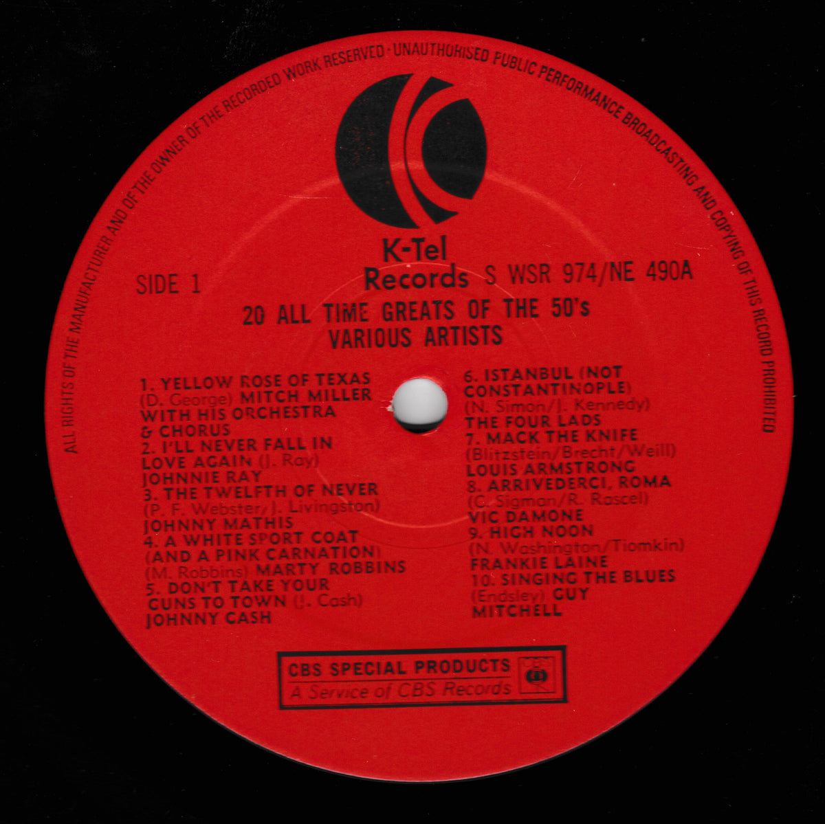 A red K-Tel Records vinyl record label with black printed text and logo, photographed close up against a dark background. The label includes track listing text and CBS Special Products branding.