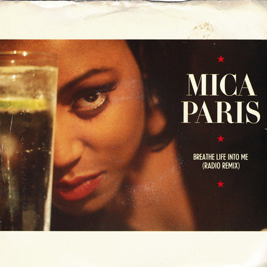 Album cover for 'Breathe Life Into Me (Radio Remix)' by Mica Paris, featuring a close-up portrait of the artist next to a glass of dark beverage, with white text on a black background.
