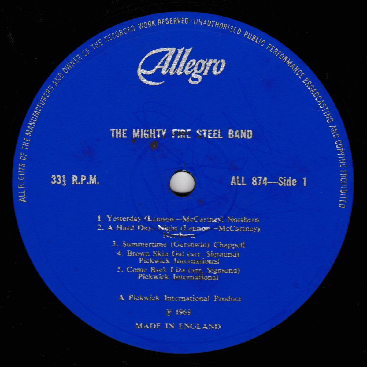 A blue vinyl record label with white text reading 'Allegro' and 'The Mighty Fire Steel Band', photographed against a black record surface.