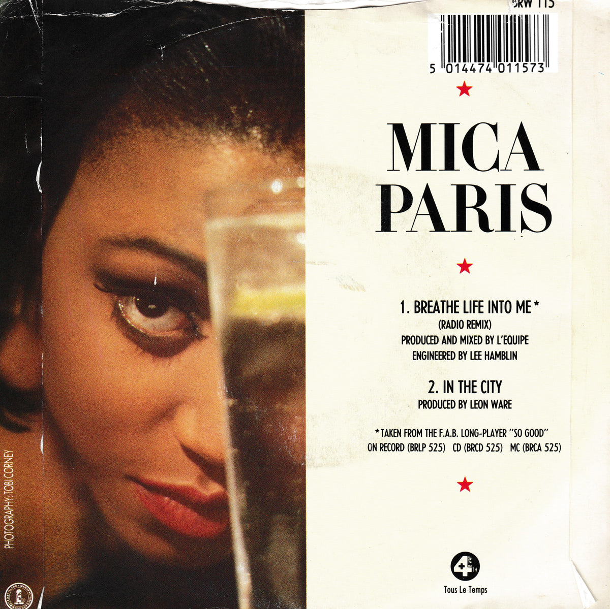 The back cover of a Mica Paris vinyl record, featuring a close-up photograph of a woman on the left and track listing details on the right against a cream-coloured background.