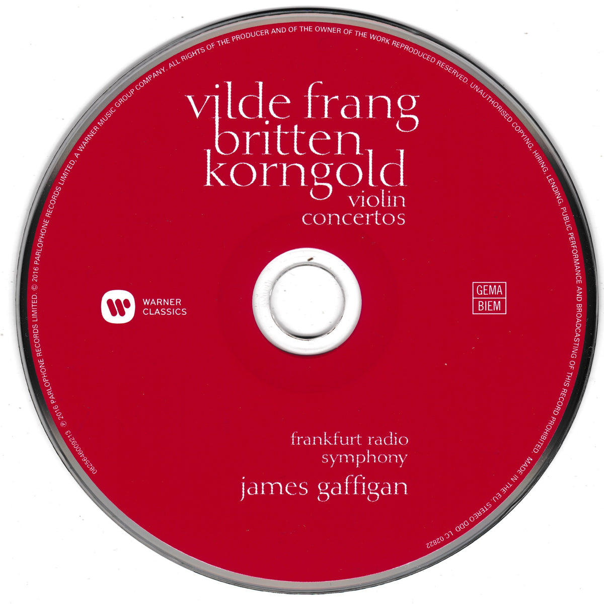 A red compact disc with white text reading 'vilde frang britten korngold violin concertos' and 'frankfurt radio symphony james gaffigan,' plus Warner Classics and GEMA/Biem logos, photographed on a white background.