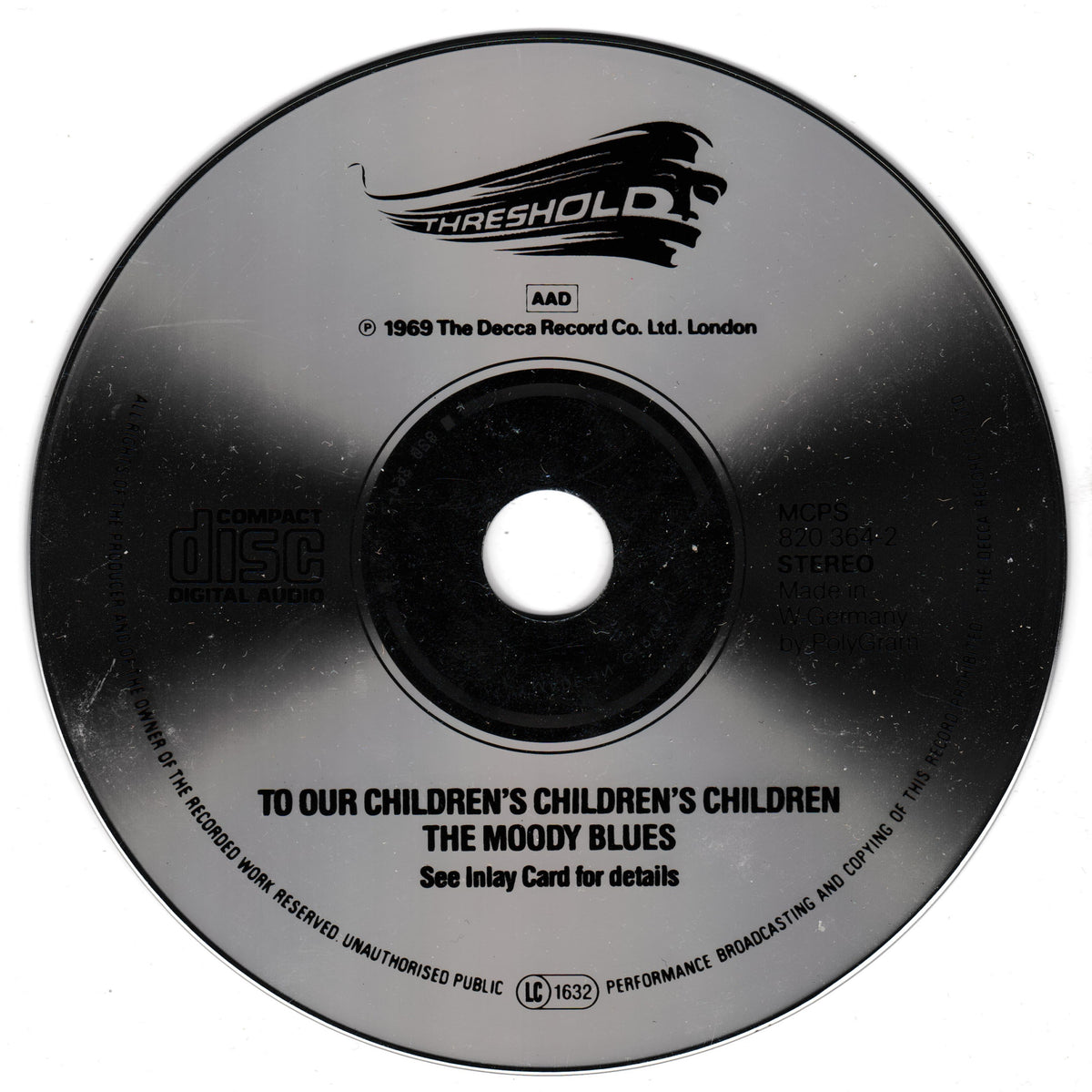 A black compact disc with printed text and the Threshold logo, photographed on a plain white background.