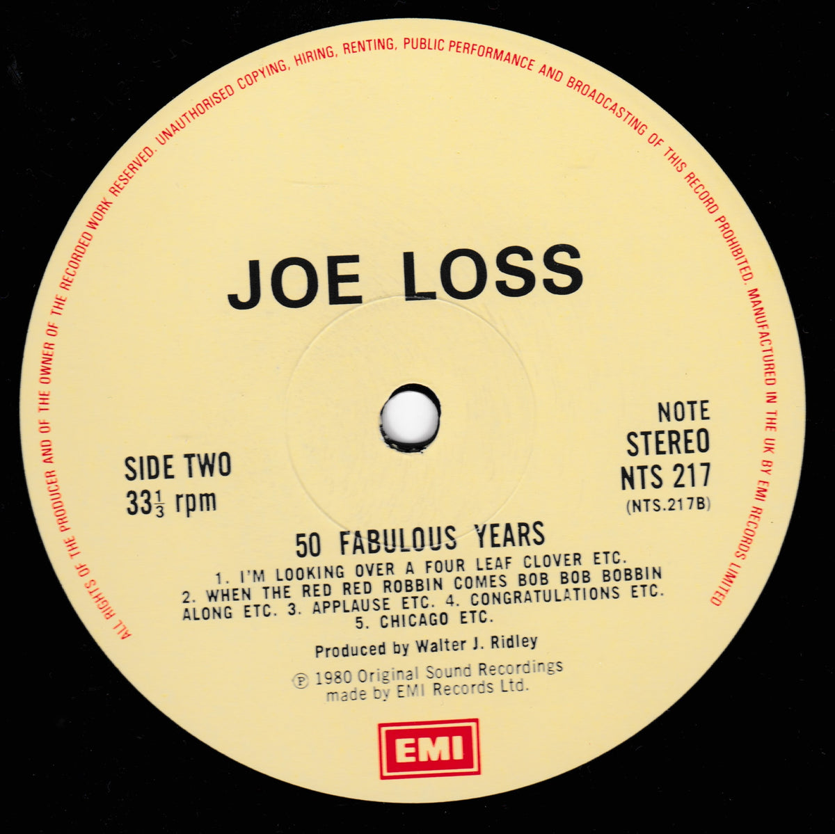 A vintage vinyl record label for Joe Loss's '50 Fabulous Years' on EMI Records. The circular label is cream-colored with black text and red warning text printed along the outer edge, set against a black vinyl background.