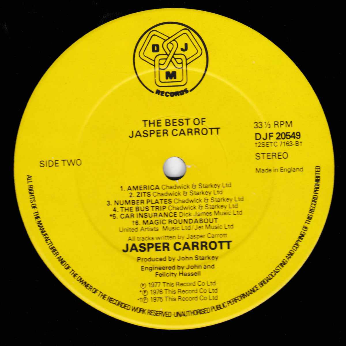 A yellow vinyl record label for Jasper Carrott's 'The Best of Jasper Carrott' on DJM Records, featuring black text and track listing details on a black background.