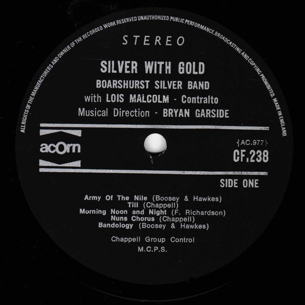 A close-up of a black vinyl record label with white printed text. The label reads 'STEREO', 'SILVER WITH GOLD', 'BOARSHURST SILVER BAND', 'with LOIS MALCOLM - Contralto', and lists track titles including 'Army Of The Nile' and 'Till (Chappell)'.
