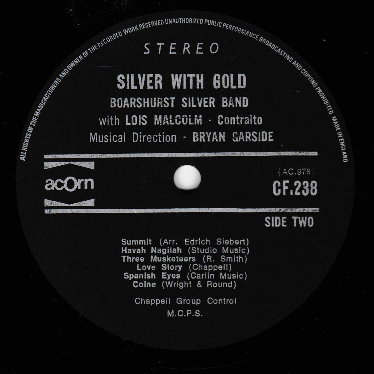 A black vinyl record label with white printed text reading 'STEREO' and 'SILVER WITH GOLD' by Boarshurst Silver Band, including artist credits and track listing for Side Two. The Acorn logo is visible on the left side.