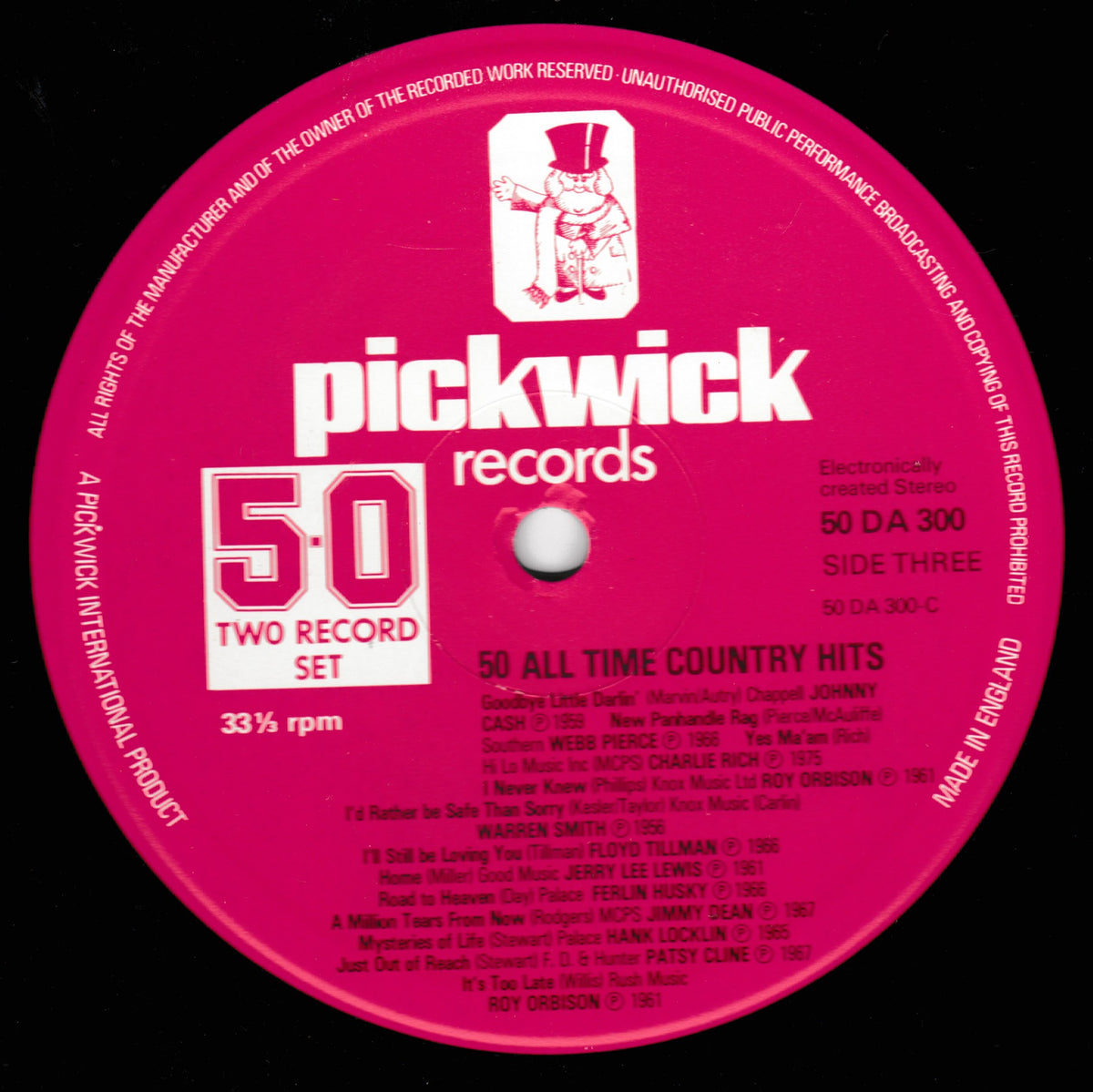 A close-up of a pink vinyl record label for Pickwick Records, showing the white logo, '50 Two Record Set' text, and track listing for '50 All Time Country Hits' Side Three.