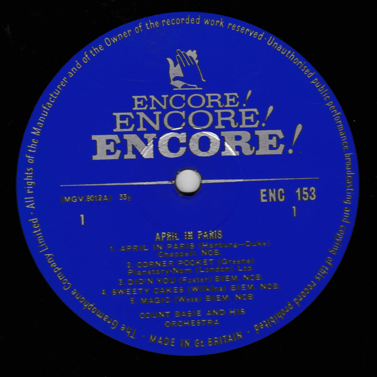 A blue and black vinyl record label with the title 'ENCORE!' in large white letters and track listing text below, photographed close up.