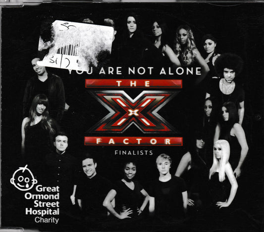 The X Factor Finalists charity single cover featuring a black-and-white group photo collage of contestants around the central red and black 'The X Factor' logo, with white text reading 'You Are Not Alone' and a Great Ormond Street Hospital Charity logo in the lower left.