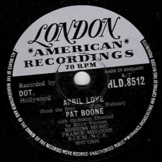 A close-up of a vintage 78 RPM vinyl record label for London American Recordings, featuring the song 'April Love' by Pat Boone.