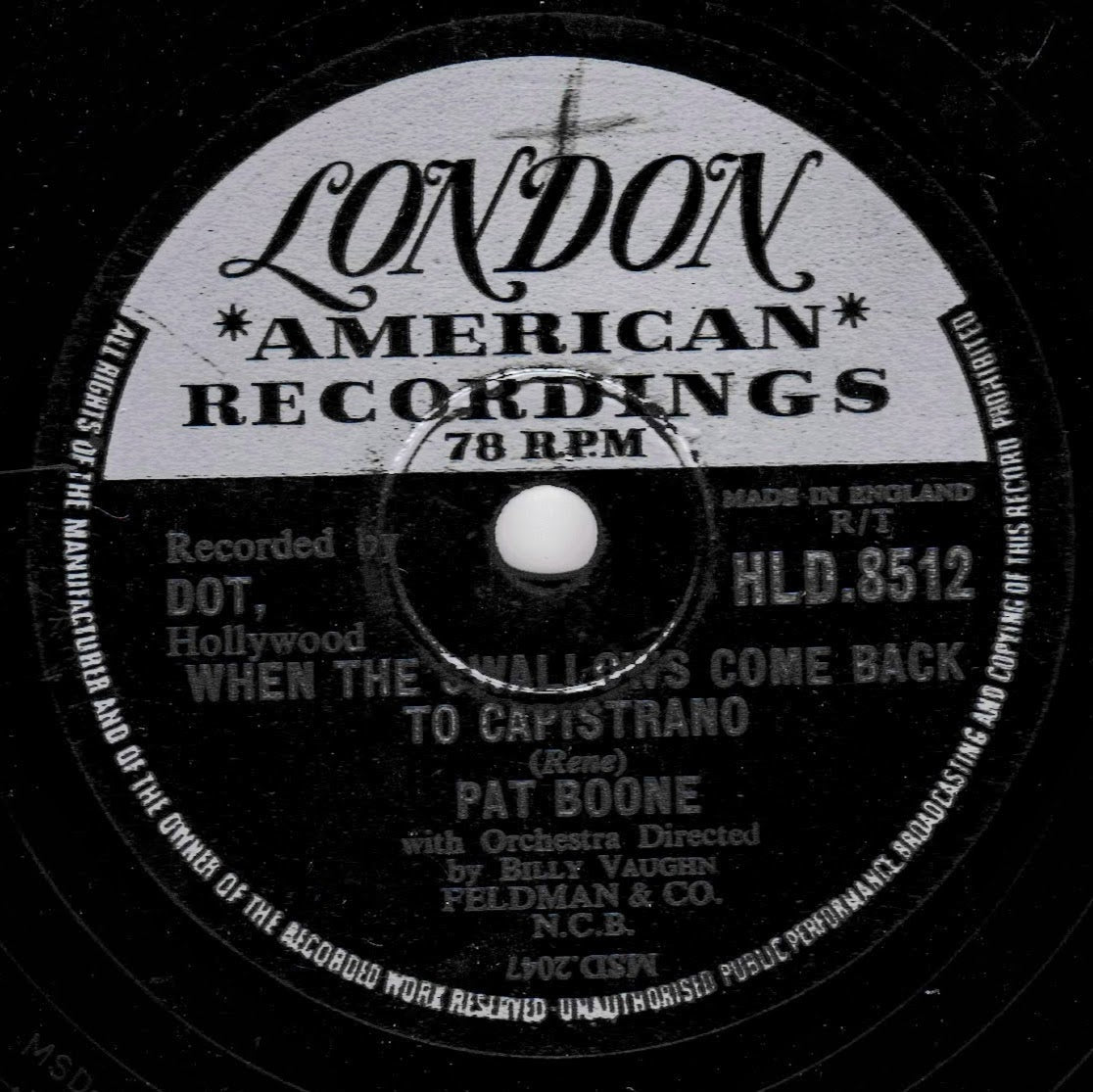 A close-up of a vintage black-and-white London American Recordings 78 RPM record label for Pat Boone's 'To Capistrano (Rene)', showing printed text and catalog markings.
