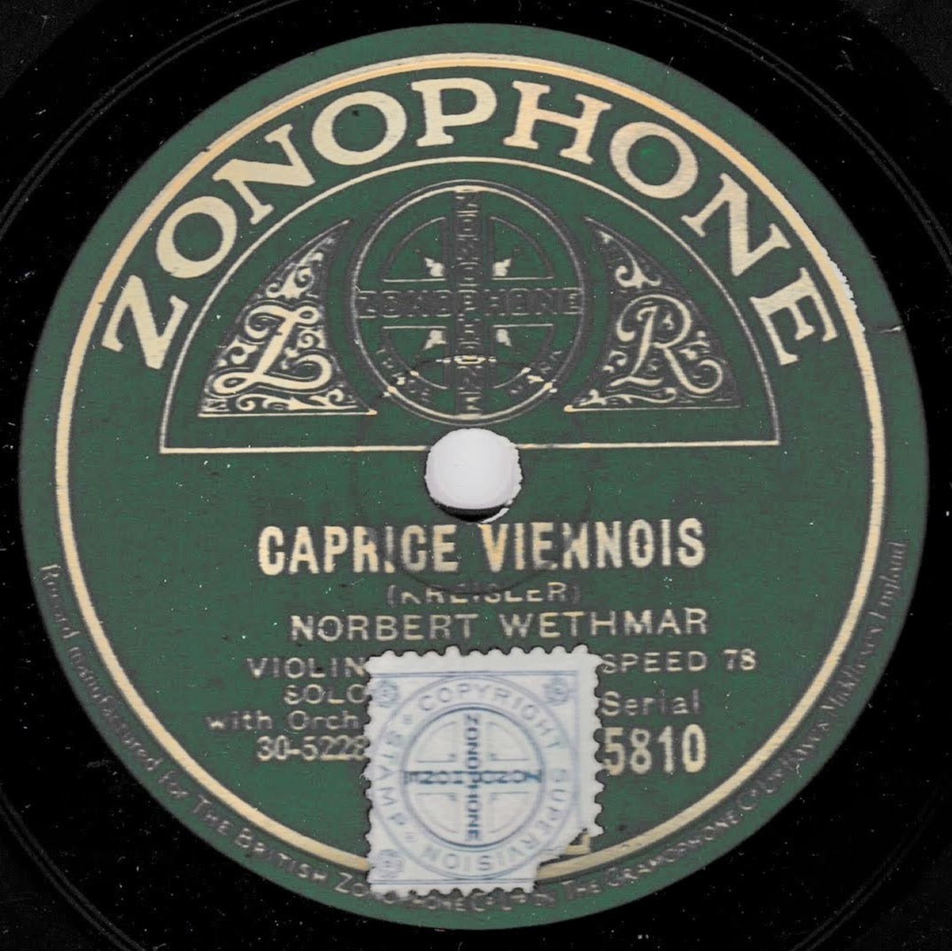 A vintage Zonophone record label for 'Caprice Viennois' by Norbert Wethmar, featuring a dark green centre label with gold lettering and a white postage stamp covering part of the lower centre.