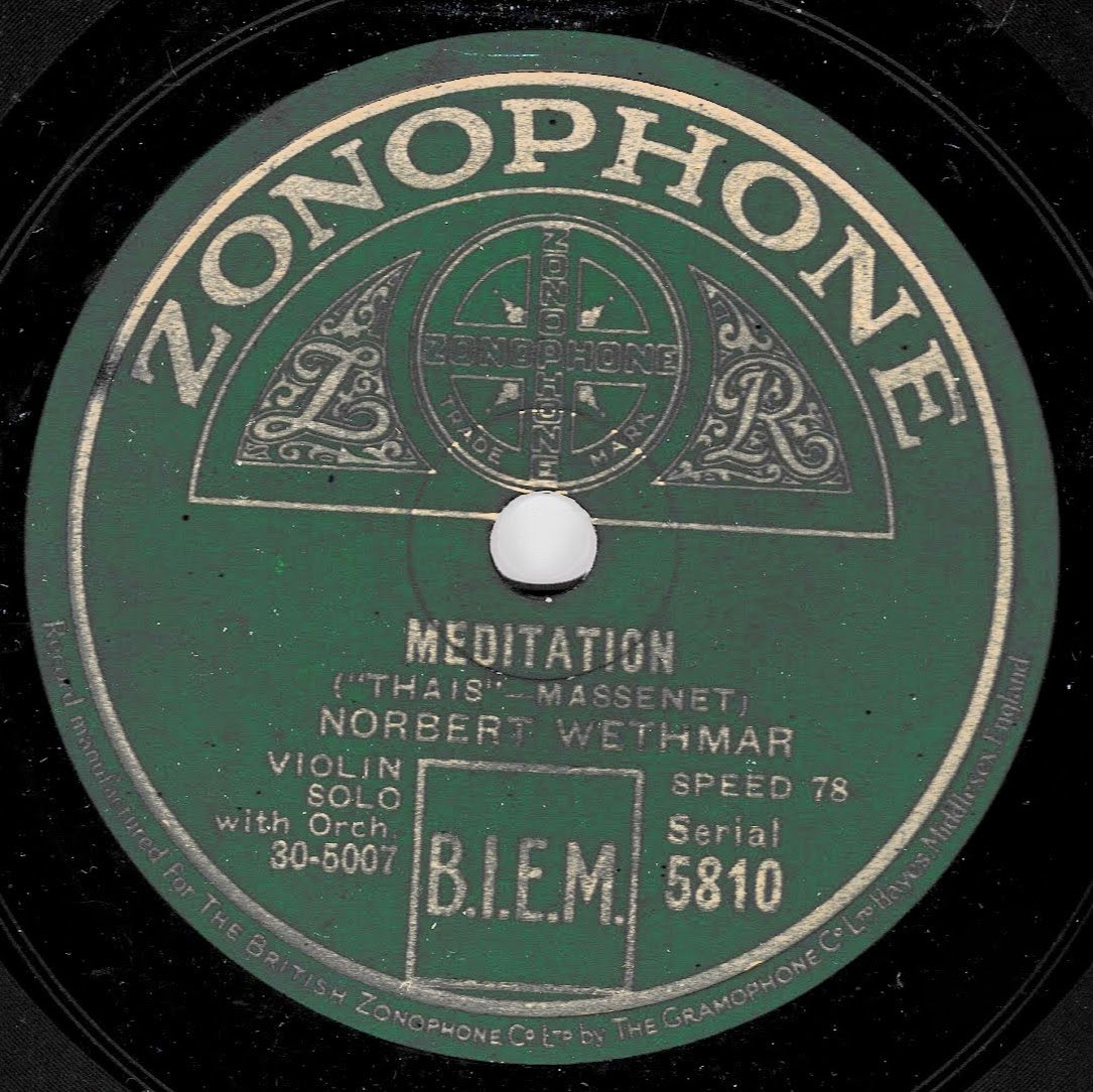 A vintage green record label from Zonophone with the title 'Meditation' by Norbert Wethmar, featuring ornate printed text and logos, photographed close up on a black shellac surface.