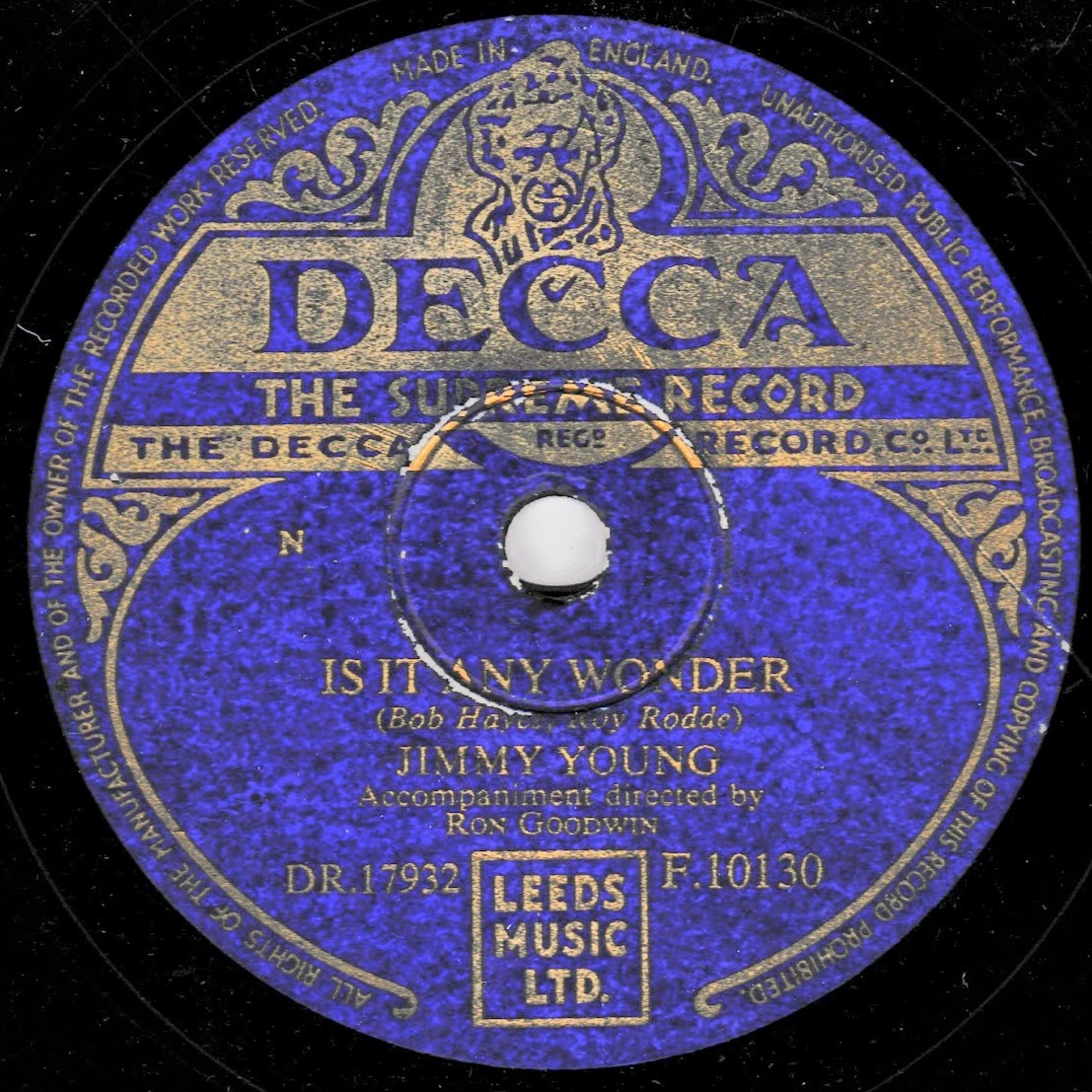 A vintage Decca 10-inch record label for 'Is It Any Wonder' by Jimmy Young, featuring a deep blue and gold design with the Decca logo and publisher Leeds Music Ltd.