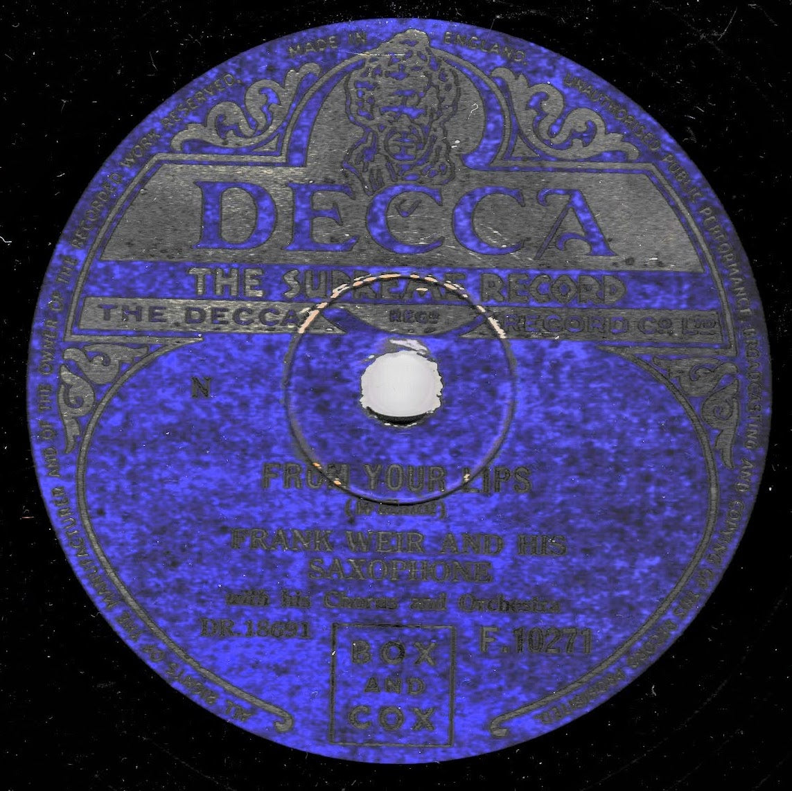 A vintage blue and silver DECCA record label for Frank Weir and His Saxophone's 'From Your Lips', featuring ornate decorative border text on a black background.