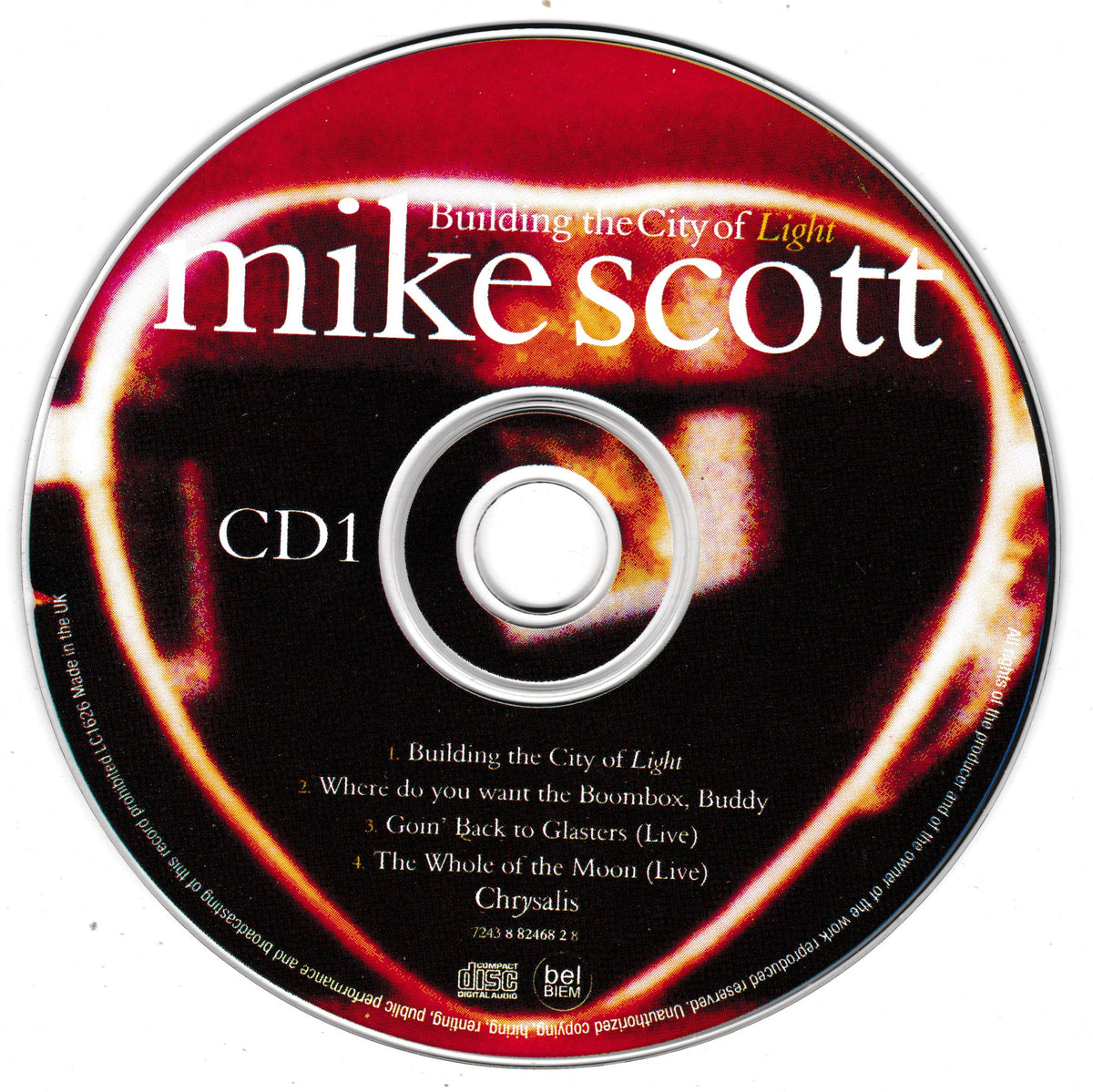 A CD disc for Mike Scott's single 'Building the City of Light' on Chrysalis, featuring a red and black abstract cover design with white and yellow text.