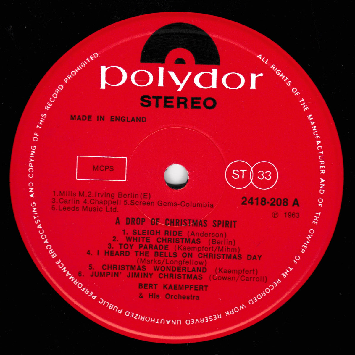 A red Polydor Stereo 12-inch vinyl record label for 'A Drop of Christmas Spirit' by Bert Kaempfert and His Orchestra, featuring track listings and the Polydor brand logo.