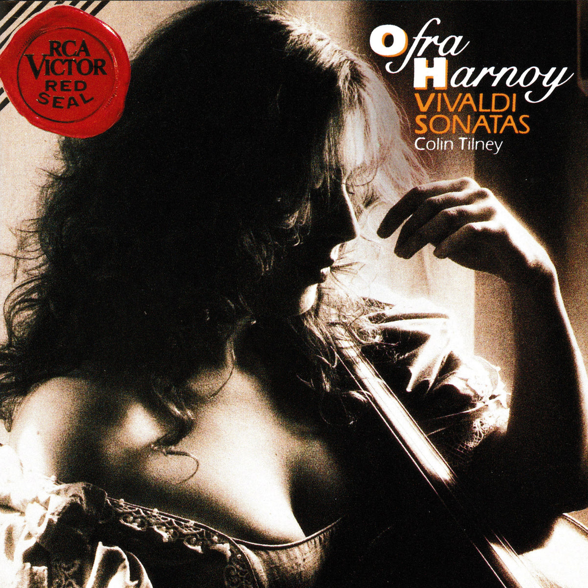 Album cover for Ofra Harnoy's 'Vivaldi Sonatas' with Colin Tilney, featuring a sepia-toned photograph of a woman holding a violin. A red circular 'RCA Victor Red Seal' logo appears in the top-left corner, and the album title and artist names are printed in white and orange text on the right.