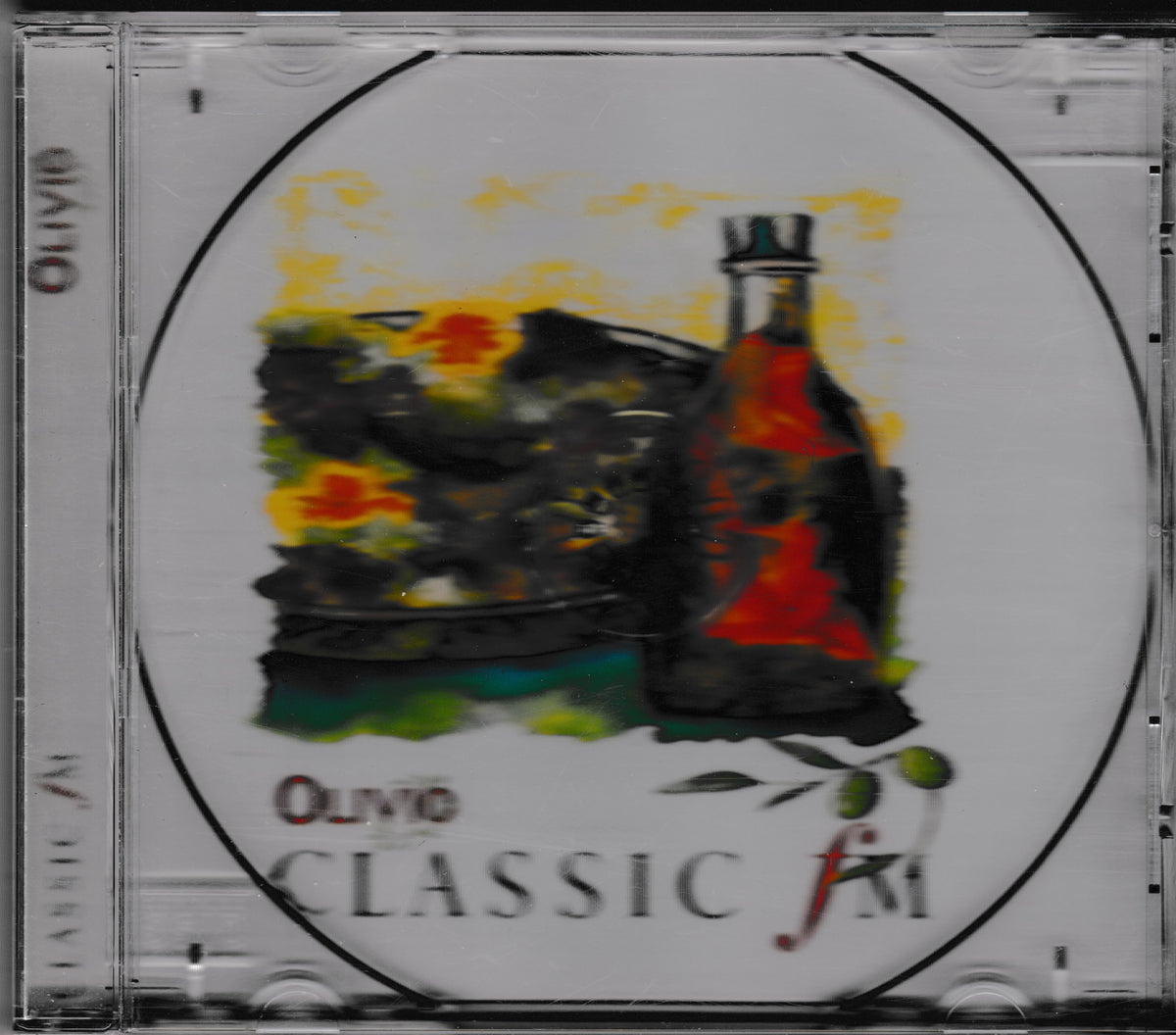 A CD jewel case containing a music release titled 'Olivia - Classic FM'. The cover art features an abstract painting of an olive oil bottle and olives on a white background.