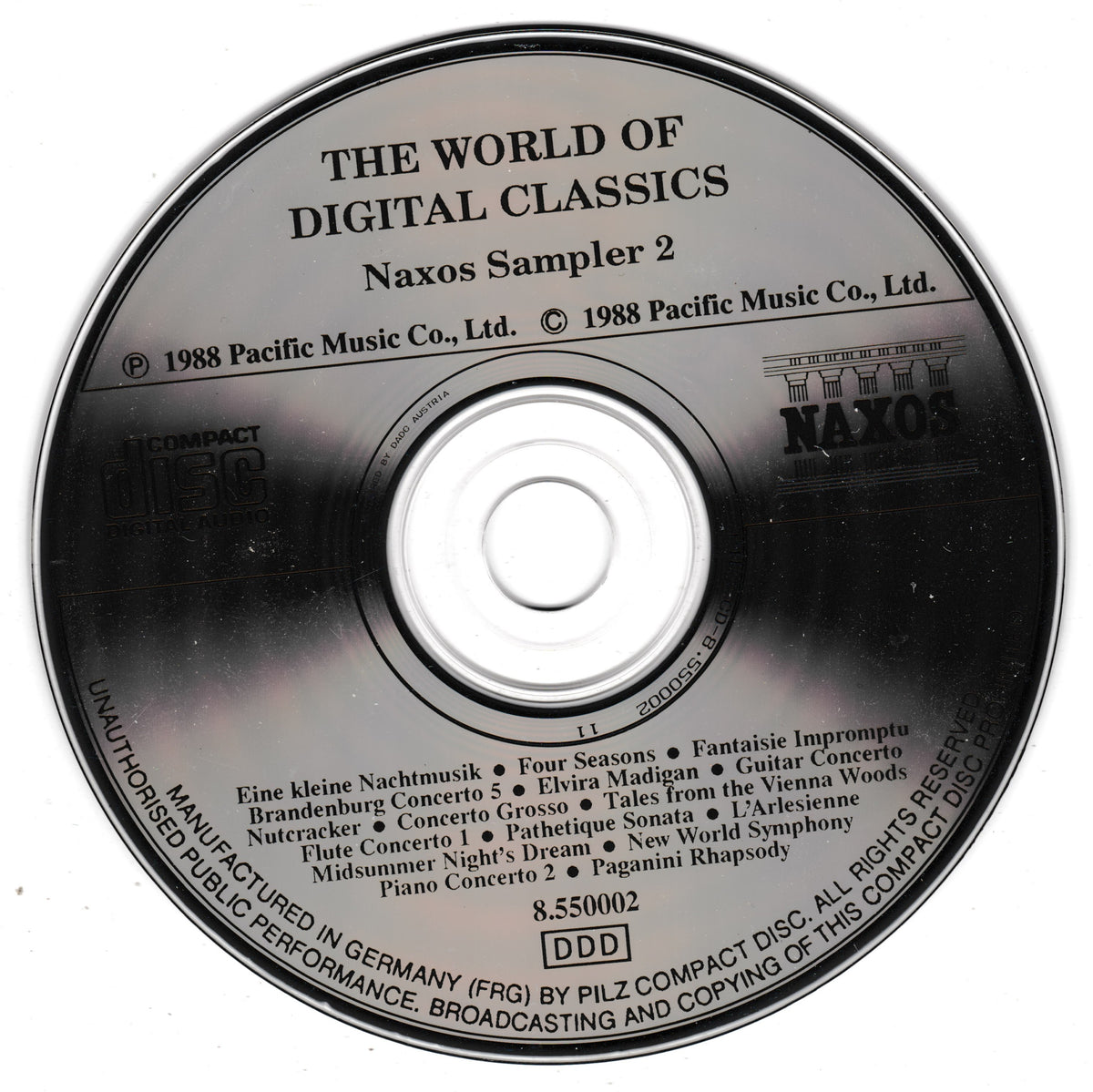 A close-up of a CD disc label for 'The World of Digital Classics - Naxos Sampler 2' by Pacific Music Co., Ltd.